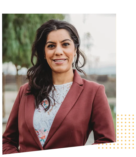 Dr. Rosy Gill smiling in a professional portrait.